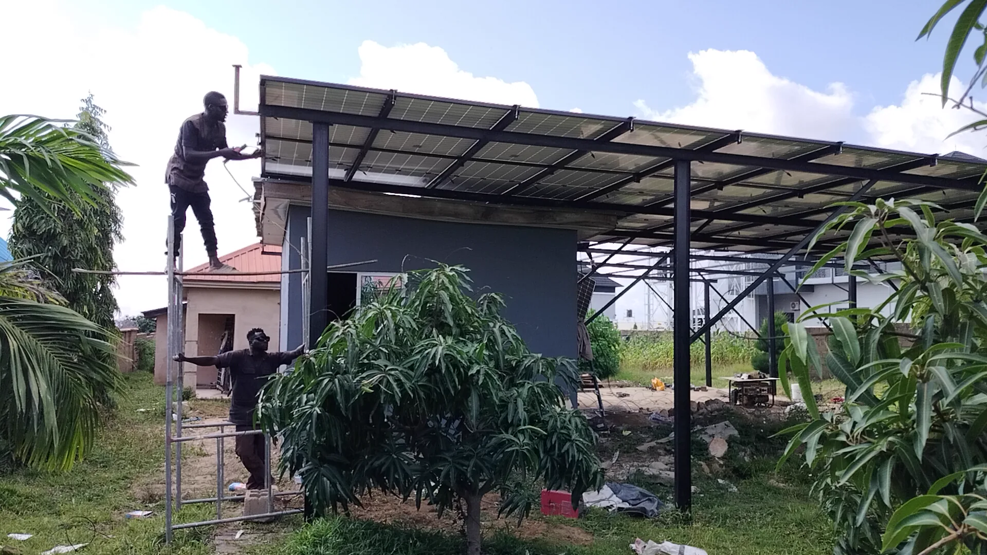 Field team working on the solar carport roof